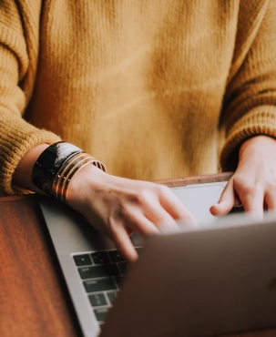 A person typing on a laptop